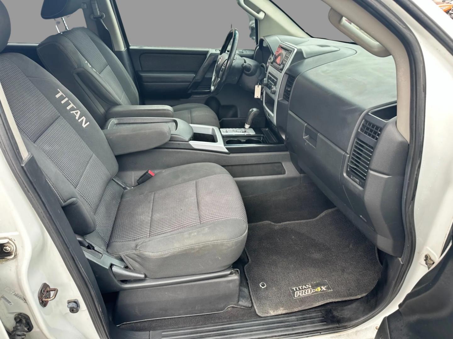 2013 White /Black Nissan Titan Pro-4X (1N6AA0EC0DN) with an 5.6L DOHC 32V V8 engine, Automatic transmission, located at 547 E. Main St., Orwell, OH, 44076, (440) 437-5893, 41.535435, -80.847855 - This 2013 Nissan Titan Pro-4X Crew Cab is a capable and well-equipped full-size pickup truck. It features a powerful 5.6L Endurance V8 engine paired with a 5-speed automatic transmission, a locking rear differential for improved traction, and a maximum towing capacity of 9,300 pounds. The truck is l - Photo#29